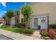 Charming townhome featuring a white door, manicured landscaping, and black shutters for added curb appeal at 13751 Juniper Blossom Dr, Tampa, FL 33618