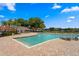 Community pool with brick patio and lounge chairs at 13751 Juniper Blossom Dr, Tampa, FL 33618