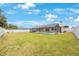 Spacious backyard featuring a screened pool area and well-maintained lawn at 13821 Joyce Dr, Largo, FL 33774