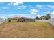 Expansive backyard with a screened pool area, ideal for outdoor activities at 13821 Joyce Dr, Largo, FL 33774