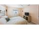 Bright bedroom with a soft color palette, a view to the backyard, and modern furnishings at 13821 Joyce Dr, Largo, FL 33774