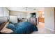 Comfortable bedroom with ensuite bath, a dresser and a work space, offering a retreat-like space at 13821 Joyce Dr, Largo, FL 33774