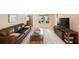 The living room has tile floors, a ceiling fan and a nice window for lots of natural light at 13821 Joyce Dr, Largo, FL 33774