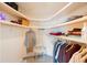 Organized walk-in closet offering ample space for clothes and accessories, with shelves and hanging rods at 13821 Joyce Dr, Largo, FL 33774