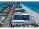 An overhead shot of a condo building near the beach featuring a parking lot at 1400 Gulf Blvd # 804, Clearwater Beach, FL 33767