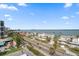 Elevated street view showcases condos with nearby shops, restaurants, and beach at 1400 Gulf Blvd # 804, Clearwater Beach, FL 33767