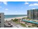 Elevated view of beachfront condos featuring parking, beach access, and ocean views at 1400 Gulf Blvd # 804, Clearwater Beach, FL 33767