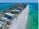 Aerial shot of beachfront condos boasting private beach access and clear ocean views at 1400 Gulf Blvd # 804, Clearwater Beach, FL 33767