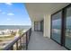 Wide balcony featuring views of the water and a neighborhood at 1400 Gulf Blvd # 804, Clearwater Beach, FL 33767