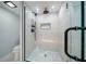 Glass enclosed shower with modern fixtures and white tiled walls at 1400 Gulf Blvd # 804, Clearwater Beach, FL 33767