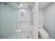 Modern bathroom featuring a glass enclosed shower with rainfall shower head and handheld sprayer at 1400 Gulf Blvd # 804, Clearwater Beach, FL 33767