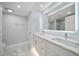 Modern bathroom featuring a double vanity, recessed lighting, and a shower with a glass door at 1400 Gulf Blvd # 804, Clearwater Beach, FL 33767