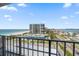 Expansive exterior view from balcony overlooking the pristine beach and coastline from a high-rise beachfront condo at 1400 Gulf Blvd # 804, Clearwater Beach, FL 33767