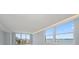 Open living room featuring large windows that offer gorgeous views of the cityscape and waterfront at 1400 Gulf Blvd # 804, Clearwater Beach, FL 33767