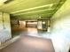 Unfinished basement with concrete walls and ceiling, offering ample storage space at 1503 Citrine Trl, Tarpon Springs, FL 34689