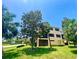 Spacious condo with large windows, screened in porch and lush greenery surrounding property at 1503 Citrine Trl, Tarpon Springs, FL 34689