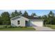 Charming one-story home with a two-car garage, manicured lawn and beautiful shrubbery at 15091 Zircon Red Dr, Wimauma, FL 33598