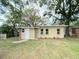Charming single-story home with mature trees and a well-maintained front yard at 1536 S Martin Luther King Jr Ave, Clearwater, FL 33756