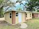 Charming single-story home featuring a light yellow exterior with brown trim and a well-maintained yard at 1536 S Martin Luther King Jr Ave, Clearwater, FL 33756