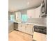 Bright kitchen featuring white cabinetry, stainless steel appliances, and modern countertops at 1536 S Martin Luther King Jr Ave, Clearwater, FL 33756