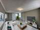 Well-decorated living room with new furniture, lighting, and flooring at 1536 S Martin Luther King Jr Ave, Clearwater, FL 33756