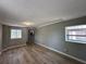 Open living room with new wood-look floors and lots of natural light at 1536 S Martin Luther King Jr Ave, Clearwater, FL 33756
