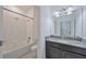 Bathroom featuring a tub and shower combo and a single sink vanity with granite counters at 16866 Balance Cv, Land O Lakes, FL 34638