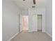 A bedroom featuring neutral gray carpet and a closet with double doors at 16866 Balance Cv, Land O Lakes, FL 34638