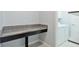 Granite countertop work area is located adjacent to the laundry appliances at 16866 Balance Cv, Land O Lakes, FL 34638