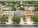 Aerial view of a neighborhood with well-manicured lawns and mature trees at 18424 Cypress Bay Pkwy, Land O Lakes, FL 34638