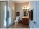 Modern bathroom with glass enclosed shower and vanity sink at 18424 Cypress Bay Pkwy, Land O Lakes, FL 34638