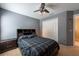Bedroom with bed with blue-and-black comforter, and double closet at 18424 Cypress Bay Pkwy, Land O Lakes, FL 34638