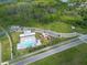 Aerial shot features a neighborhood pool, playground, and parking area with picnic spots at 18424 Cypress Bay Pkwy, Land O Lakes, FL 34638
