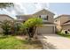 Charming two-story home with attached garage and well-maintained landscaping at 18424 Cypress Bay Pkwy, Land O Lakes, FL 34638