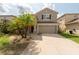 Charming two-story home with well-maintained lawn, a two car garage, and beautiful landscaping at 18424 Cypress Bay Pkwy, Land O Lakes, FL 34638