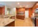 Spacious kitchen featuring granite countertops and stainless steel appliances at 18424 Cypress Bay Pkwy, Land O Lakes, FL 34638