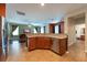 Open kitchen layout with eat-in area and view of living room at 18424 Cypress Bay Pkwy, Land O Lakes, FL 34638