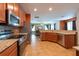 Well-equipped kitchen with stainless steel appliances and granite countertops at 18424 Cypress Bay Pkwy, Land O Lakes, FL 34638