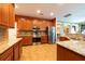 Kitchen with stainless steel appliances and granite countertops at 18424 Cypress Bay Pkwy, Land O Lakes, FL 34638