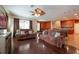 Open-concept living area with hardwood floors and connecting dining/kitchen spaces at 18424 Cypress Bay Pkwy, Land O Lakes, FL 34638