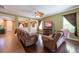 Spacious living room with hardwood floors and seamless transitions to other living spaces at 18424 Cypress Bay Pkwy, Land O Lakes, FL 34638