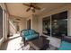 Relaxing screened patio with ceiling fan, comfortable seating, and great outdoor view at 18424 Cypress Bay Pkwy, Land O Lakes, FL 34638