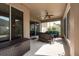 Screened patio with plenty of room for entertaining and relaxation, featuring ceiling fan at 18424 Cypress Bay Pkwy, Land O Lakes, FL 34638