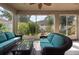 Relaxing screened patio with comfortable seating and views of the lush backyard at 18424 Cypress Bay Pkwy, Land O Lakes, FL 34638