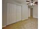 Bright bedroom featuring a ceiling fan, and a large closet at 1850 Fuller Dr, Clearwater, FL 33755