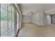 Spacious, bright living space with tiled flooring, French doors and neutral walls offering natural light at 1850 Fuller Dr, Clearwater, FL 33755