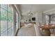 Open living space with tiled flooring, a ceiling fan, and French doors leading to the backyard at 1850 Fuller Dr, Clearwater, FL 33755