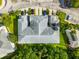 Aerial view of a condo complex with parking and landscaped grounds at 1936 Heron Cove Dr # 104, Lutz, FL 33549
