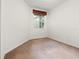 Cozy bedroom with neutral carpet and a bright window at 1936 Heron Cove Dr # 104, Lutz, FL 33549