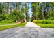 A community boat ramp with a wooden bridge for launching boats into the water at 1936 Heron Cove Dr # 104, Lutz, FL 33549
